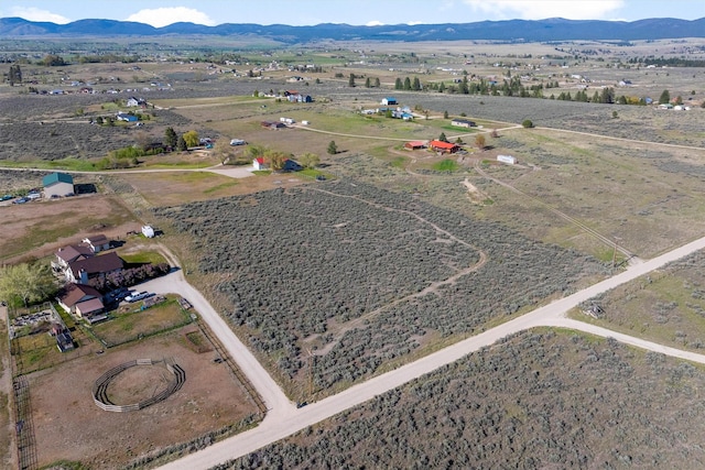 999 Websters Way, Stevensville, MT 59870 - aerial overview of property's location featuring a mountain backdrop and rural landscape