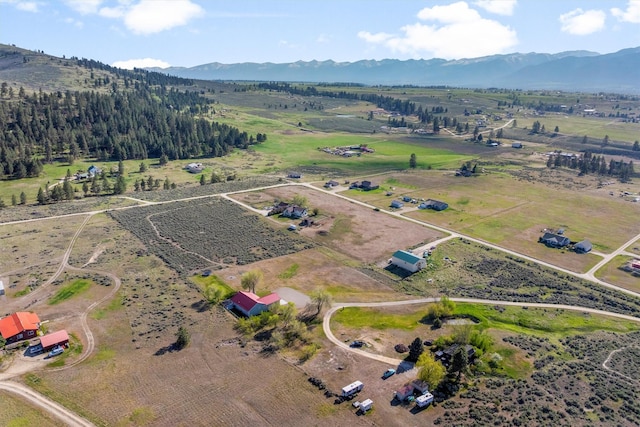 999 Websters Way, Stevensville, MT 59870 - aerial view of property's location featuring a mountain backdrop, rural landscape, and property parcel outlined