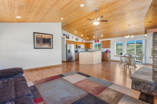 999 Websters Way, Stevensville, MT 59870 - living area with wooden ceiling, wood finished floors, a chandelier, ceiling fan, and baseboards