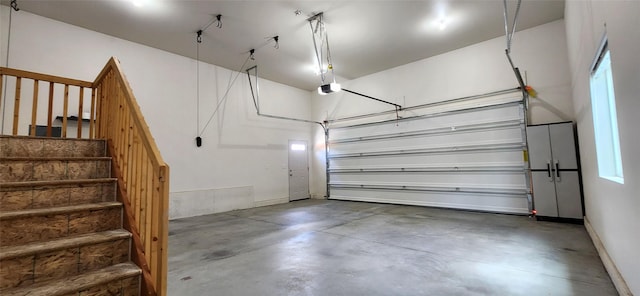 999 Websters Way, Stevensville, MT 59870 - garage featuring a garage door opener and baseboards