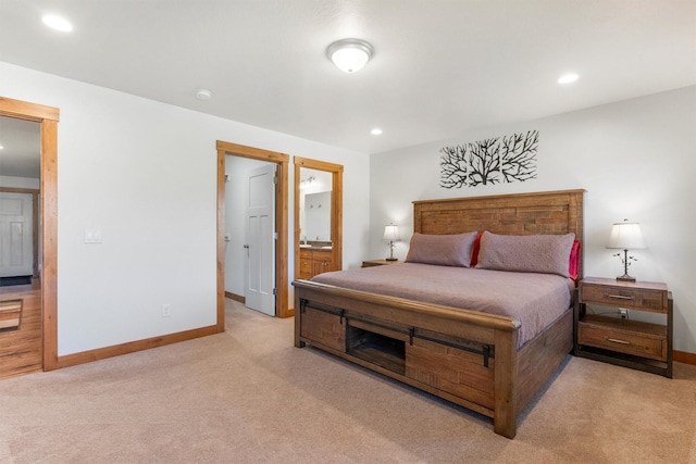 999 Websters Way, Stevensville, MT 59870 - bedroom featuring light colored carpet, baseboards, recessed lighting, and connected bathroom