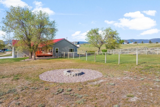 999 Websters Way, Stevensville, MT 59870 - view of yard with a wooden deck and an outdoor fire pit