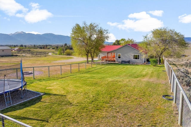 999 Websters Way, Stevensville, MT 59870 - view of yard featuring a trampoline and a mountain view