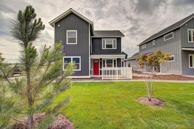 view of front of home featuring a porch and a front yard