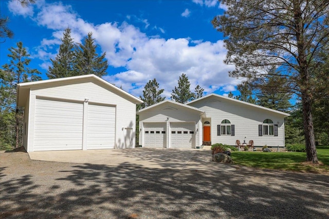 141 Aspen Ln, Eureka, MT 59917 - ranch-style house with a garage and an outbuilding
