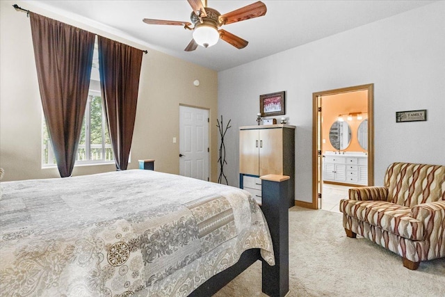141 Aspen Ln, Eureka, MT 59917 - bedroom featuring light colored carpet, ceiling fan, and connected bathroom