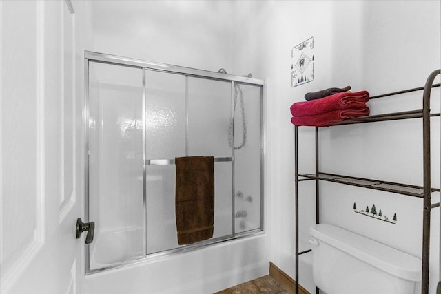 141 Aspen Ln, Eureka, MT 59917 - bathroom featuring shower / bath combination with glass door and toilet