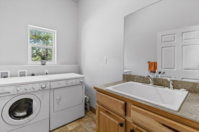 141 Aspen Ln, Eureka, MT 59917 - washroom featuring washing machine and dryer and a sink