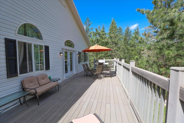 141 Aspen Ln, Eureka, MT 59917 - wooden deck with outdoor dining space and french doors