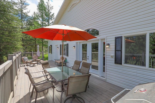 141 Aspen Ln, Eureka, MT 59917 - wooden deck featuring outdoor dining space and french doors