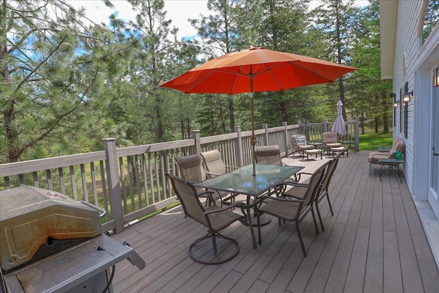 141 Aspen Ln, Eureka, MT 59917 - wooden terrace featuring outdoor dining space and a grill