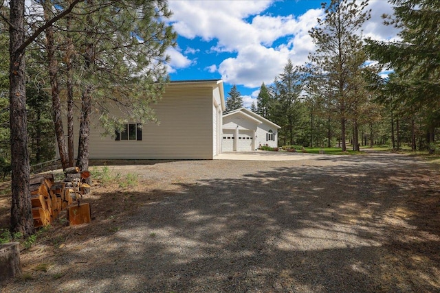 141 Aspen Ln, Eureka, MT 59917 - view of property exterior with a garage and driveway