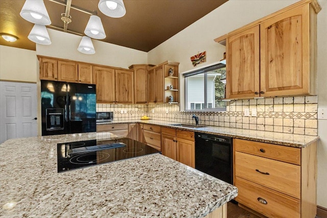 141 Aspen Ln, Eureka, MT 59917 - kitchen with black appliances, open shelves, light stone counters, decorative backsplash, and hanging light fixtures