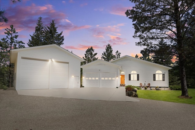 141 Aspen Ln, Eureka, MT 59917 - ranch-style house with an outbuilding, a lawn, and driveway
