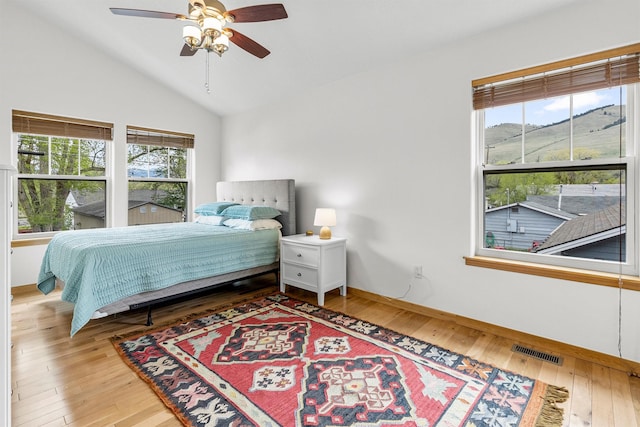 318 Dearborn Ave, Missoula, MT 59801 - bedroom with lofted ceiling, hardwood / wood-style floors, baseboards, and ceiling fan