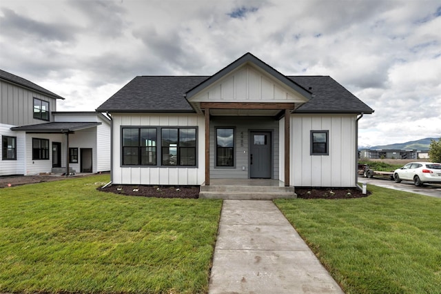 NHNLOT1 England Blvd, Missoula, MT 59808 - modern farmhouse with a shingled roof, board and batten siding, and a front yard