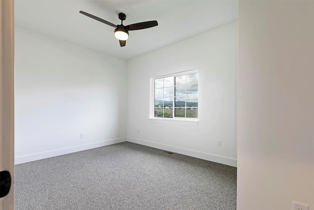 NHNLOT1 England Blvd, Missoula, MT 59808 - carpeted empty room with baseboards and a ceiling fan