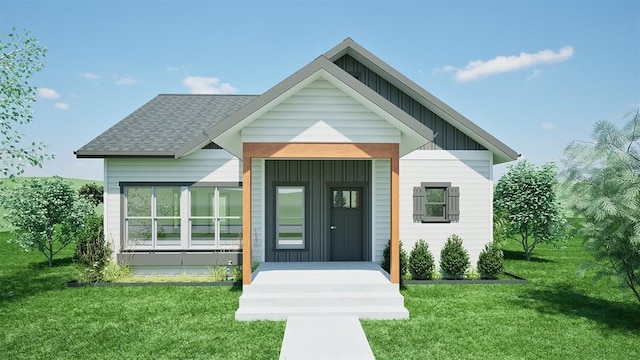 NHNLOT1 England Blvd, Missoula, MT 59808 - view of front of house with board and batten siding, a shingled roof, and a front yard