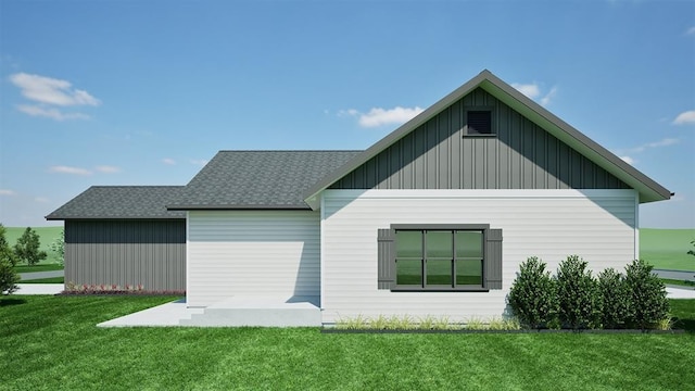 NHNLOT1 England Blvd, Missoula, MT 59808 - rear view of property with board and batten siding, a lawn, and roof with shingles