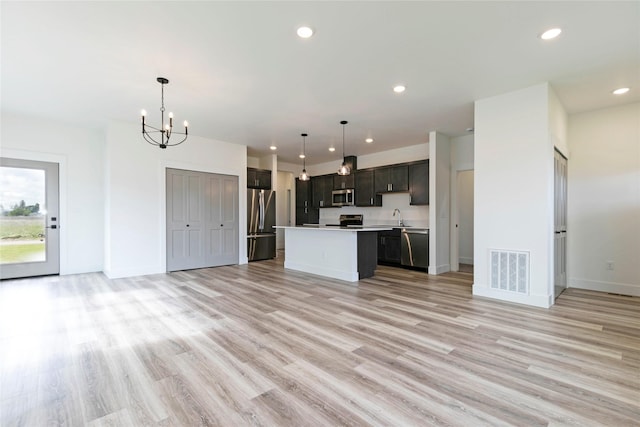 NHNLOT1 England Blvd, Missoula, MT 59808 - kitchen featuring open floor plan, stainless steel appliances, light countertops, a chandelier, and a center island
