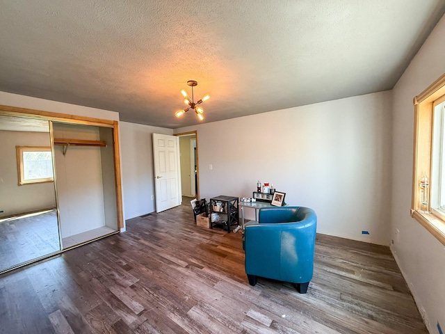 485 Wilson Butte Rd, Great Falls, MT 59405 - living area featuring wood finished floors, a chandelier, and a textured ceiling