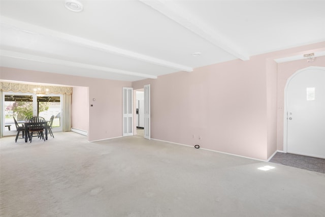 3313 5th Ave N, Great Falls, MT 59401 - entryway featuring light colored carpet, beam ceiling, baseboards, and arched walkways