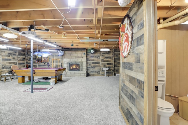 3313 5th Ave N, Great Falls, MT 59401 - unfinished basement with billiards, carpet flooring, and a brick fireplace