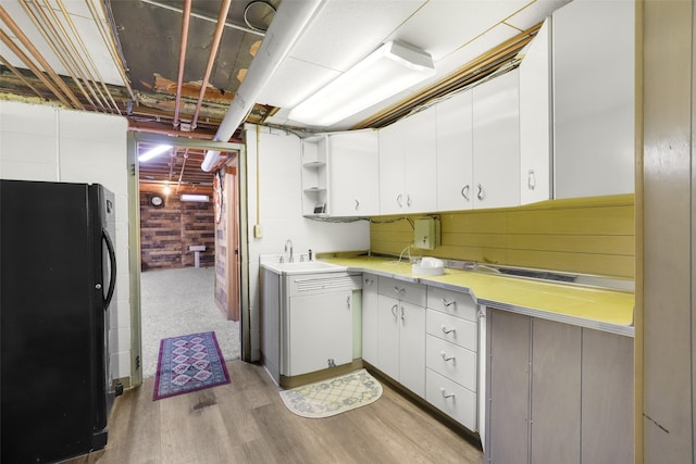 3313 5th Ave N, Great Falls, MT 59401 - kitchen featuring freestanding refrigerator, a sink, light countertops, open shelves, and white cabinetry