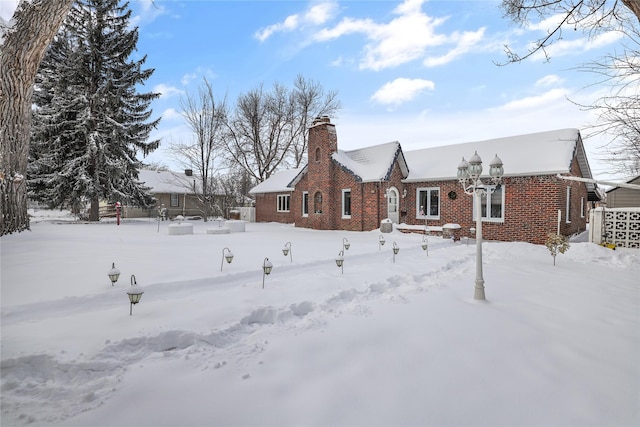 3313 5th Ave N, Great Falls, MT 59401 - snow covered house with brick siding and a chimney