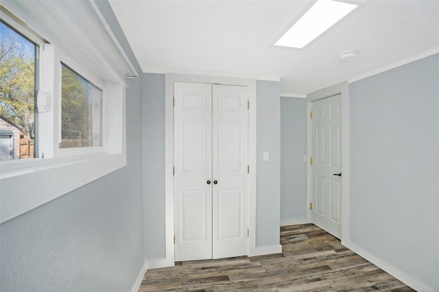 1221 7th Ave, Havre, MT 59501 - unfurnished bedroom featuring wood finished floors and a closet