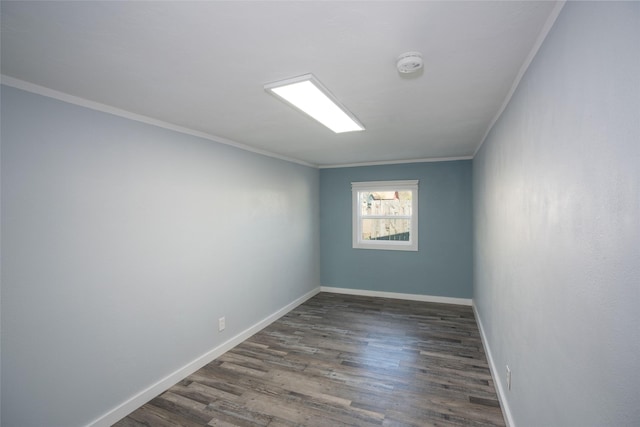 1221 7th Ave, Havre, MT 59501 - spare room with a smoke detector, crown molding, and wood finished floors