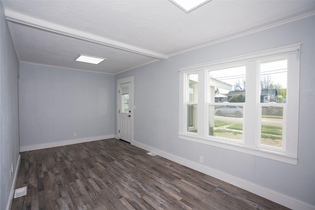 1221 7th Ave, Havre, MT 59501 - spare room featuring dark wood-type flooring and crown molding