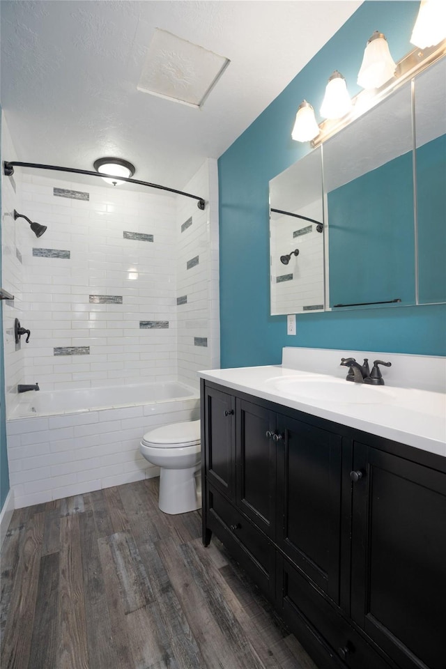 1221 7th Ave, Havre, MT 59501 - full bath with wood finished floors, vanity, and tub / shower combination