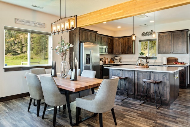 21087 Pamin Loop, Clinton, MT 59825 - dining area with dark wood-style floors, a chandelier, and recessed lighting