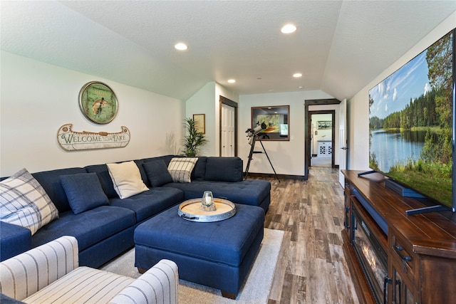 21087 Pamin Loop, Clinton, MT 59825 - living room with vaulted ceiling, wood finished floors, and recessed lighting