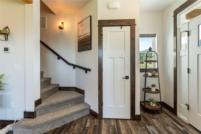 21087 Pamin Loop, Clinton, MT 59825 - foyer with dark wood-style floors and stairway