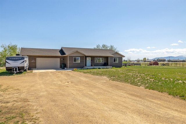 4175 Mchugh Ln, Helena, MT 59602 - ranch-style house with dirt driveway and a garage