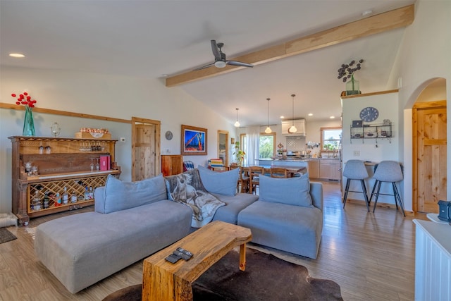 4175 Mchugh Ln, Helena, MT 59602 - living area featuring arched walkways, light wood finished floors, ceiling fan, and recessed lighting