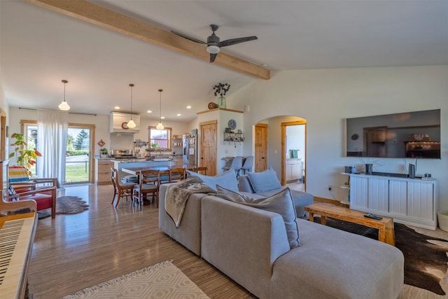 4175 Mchugh Ln, Helena, MT 59602 - living room featuring arched walkways, ceiling fan, light wood-style floors, and recessed lighting