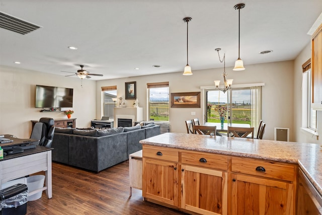 1317 Creekside Dr, Stevensville, MT 59870 - kitchen featuring a chandelier, dark wood-style floors, hanging light fixtures, a ceiling fan, and recessed lighting
