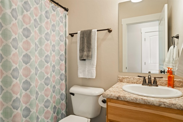 1317 Creekside Dr, Stevensville, MT 59870 - bathroom featuring vanity, toilet, and a shower with curtain