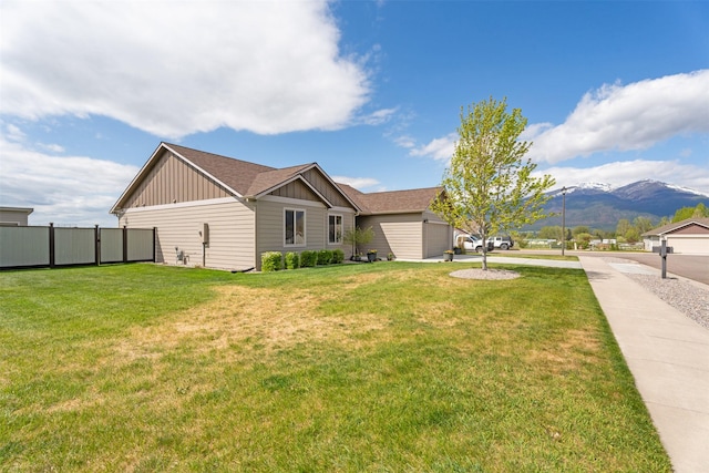 1317 Creekside Dr, Stevensville, MT 59870 - view of home's exterior featuring board and batten siding, a mountain view, and a garage