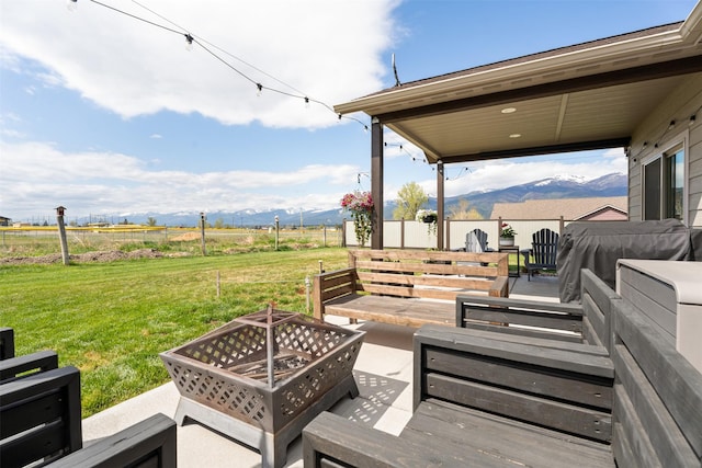 1317 Creekside Dr, Stevensville, MT 59870 - view of patio / terrace featuring a mountain view, an outdoor fire pit, and a rural view