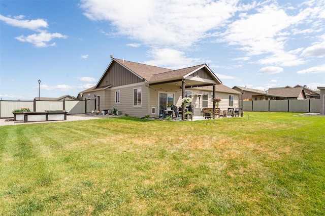 1317 Creekside Dr, Stevensville, MT 59870 - back of house featuring board and batten siding and a patio area