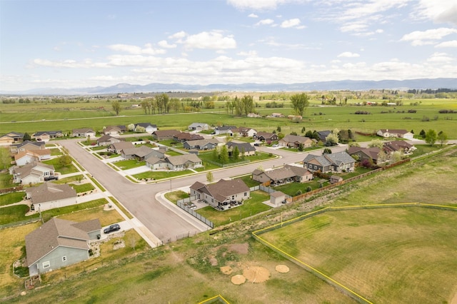 1317 Creekside Dr, Stevensville, MT 59870 - aerial perspective of suburban area featuring a mountain backdrop and property parcel outlined
