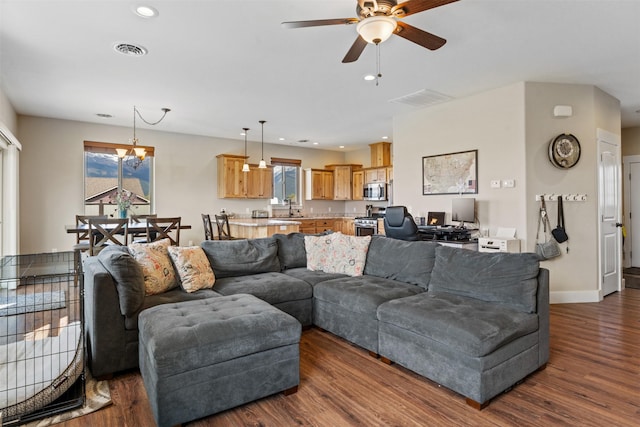 1317 Creekside Dr, Stevensville, MT 59870 - living room featuring healthy amount of natural light, ceiling fan, dark wood-style flooring, a chandelier, and recessed lighting