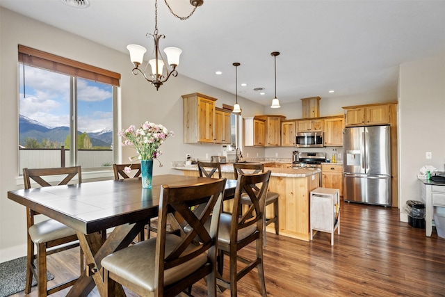 1317 Creekside Dr, Stevensville, MT 59870 - dining area with a mountain view, recessed lighting, dark wood-type flooring, and a chandelier