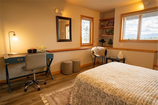 281 Eagle Bend Dr, Bigfork, MT 59911 - bedroom featuring wood finished floors and a desk