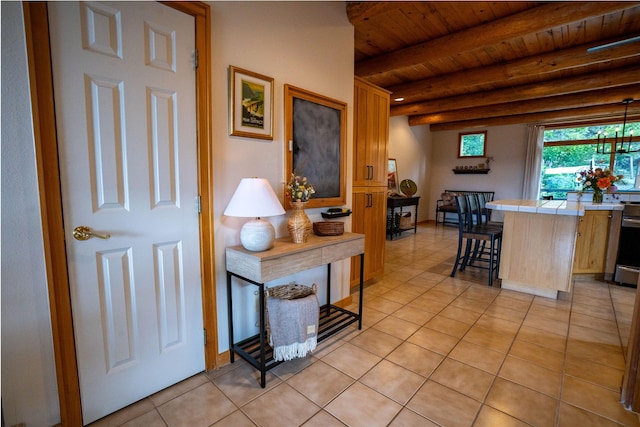 281 Eagle Bend Dr, Bigfork, MT 59911 - interior space with a wooden ceiling with exposed beams and light tile patterned floors