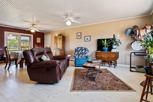 445 Sapphire Ln, Stevensville, MT 59870 - living room featuring wood finished floors, ceiling fan, and crown molding